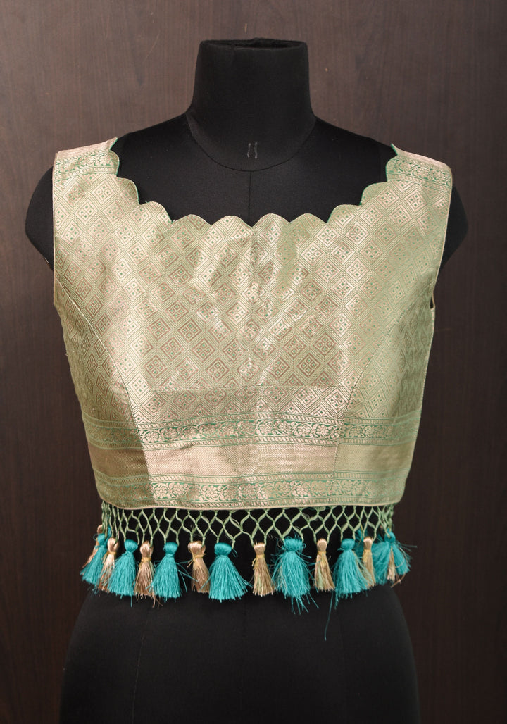 Size:36 Pure Silk Brocade Scallop neck Blouse with tassels in Aqua and water zari