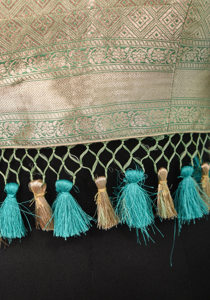 Size:36 Pure Silk Brocade Scallop neck Blouse with tassels in Aqua and water zari