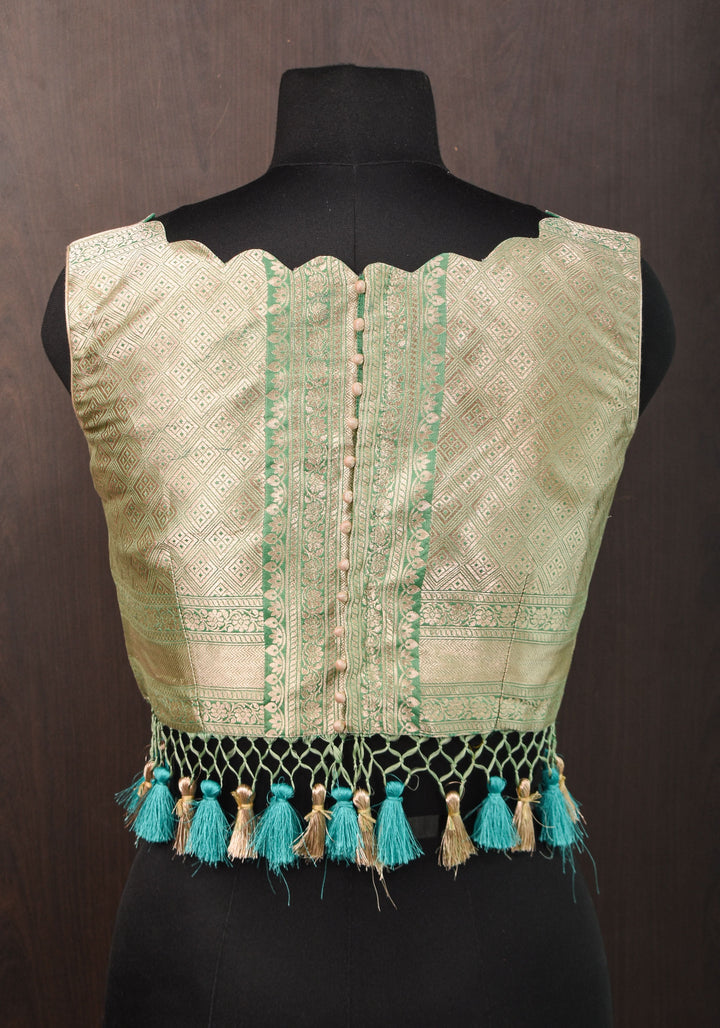 Size:36 Pure Silk Brocade Scallop neck Blouse with tassels in Aqua and water zari