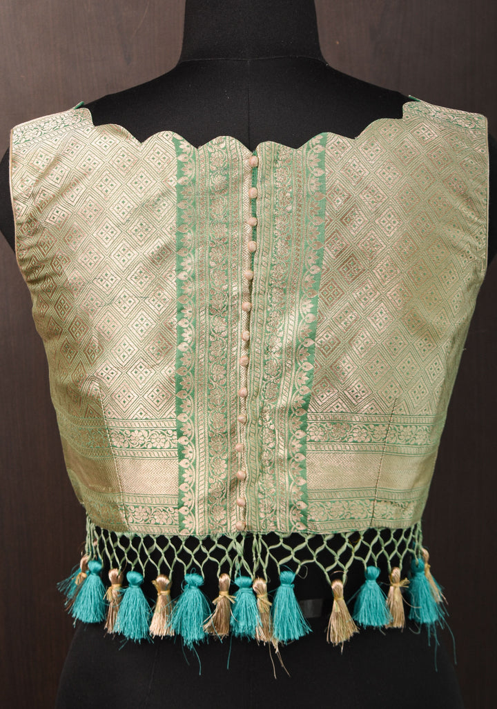 Size:36 Pure Silk Brocade Scallop neck Blouse with tassels in Aqua and water zari