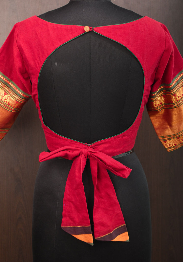 Maroon Narayanpet cotton boatneck blouse with oval cutout and tieback design