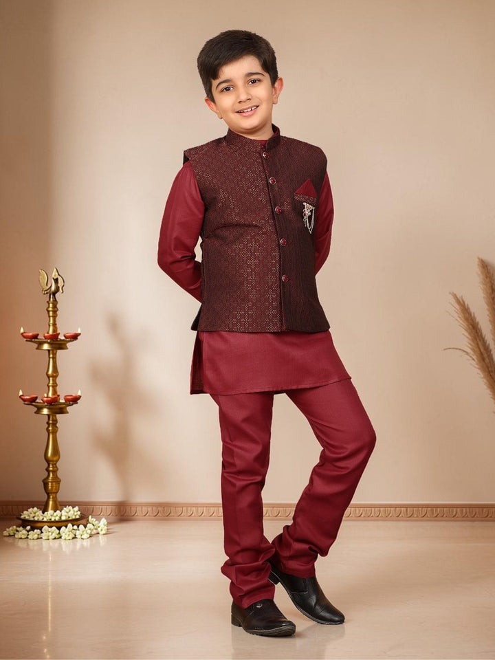 Boys Cotton Silk Solid Kurta Pyjama Set With Jacquard Geometric Floral Motifs Waistcoat - Maroon | SHOBITAM