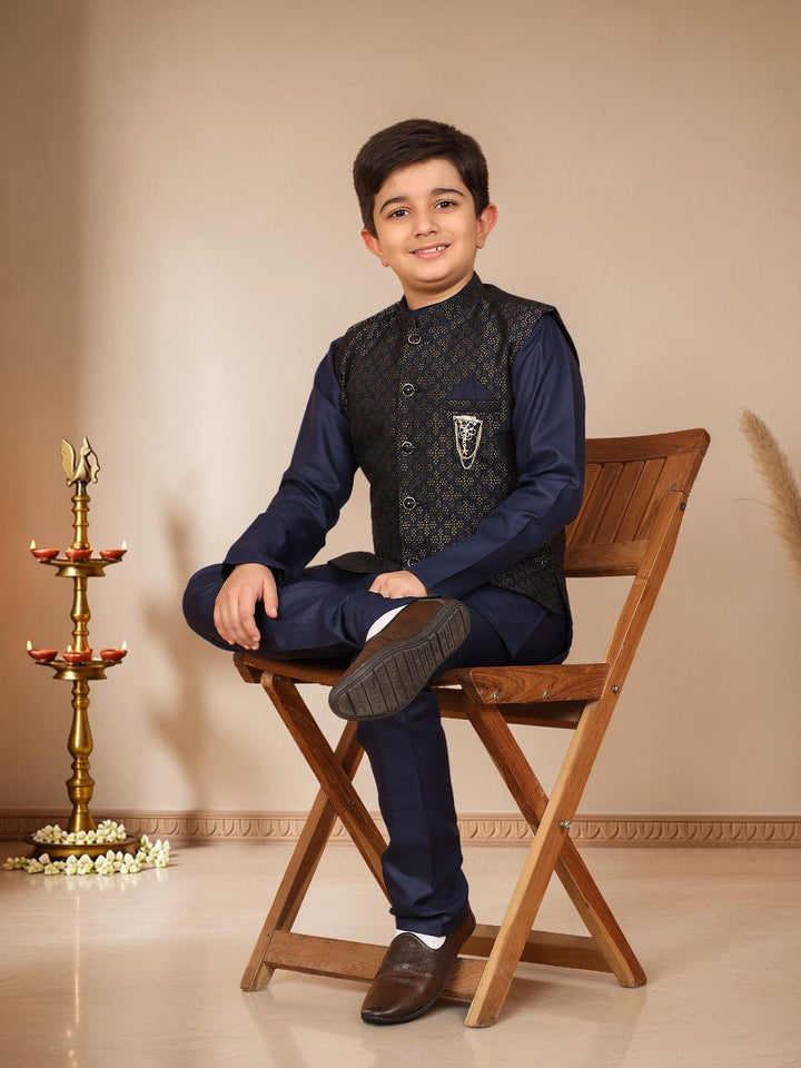Boys Cotton Silk Solid Kurta Pyjama Set With Jacquard Geometric Floral Motifs Waistcoat - Navy Blue | SHOBITAM