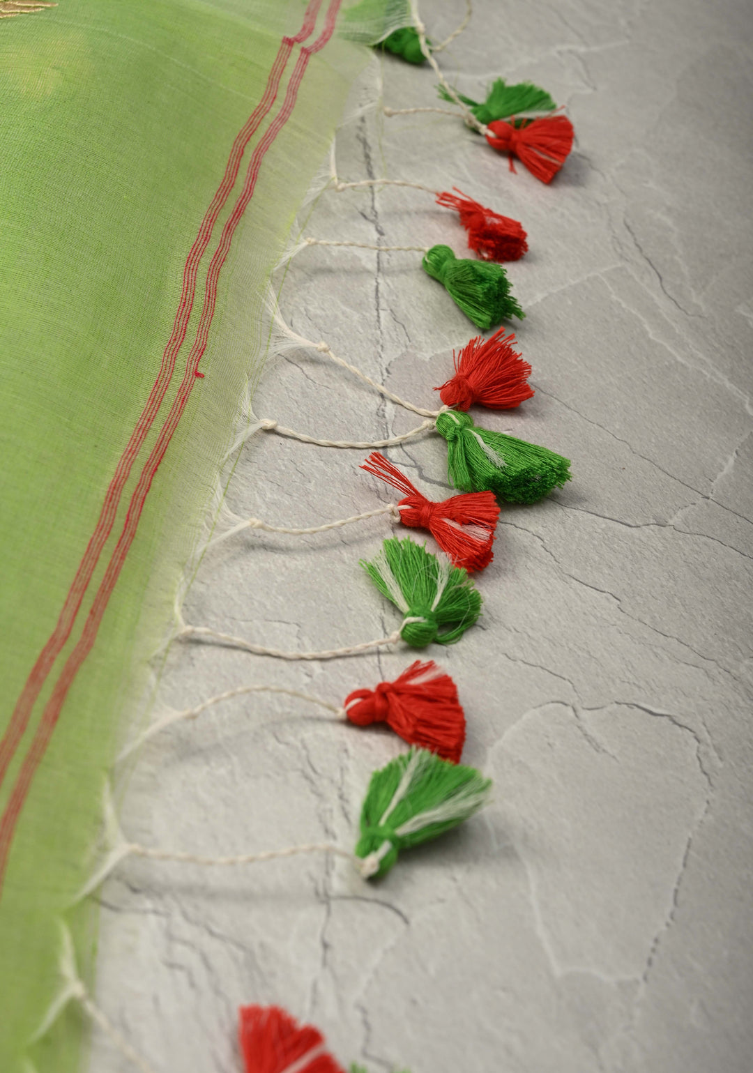 Fresh Green Mercedized Bengal cotton machine embroidered Butta and Border and long tassels