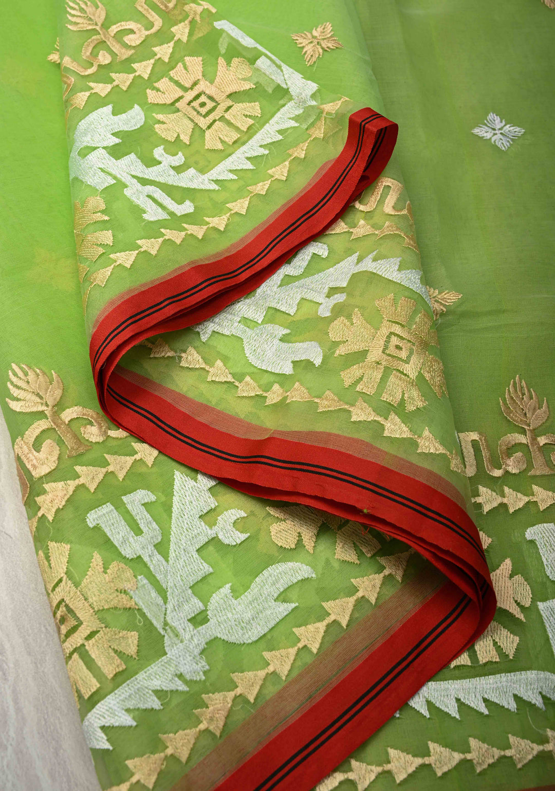 Fresh Green Mercedized Bengal cotton machine embroidered Butta and Border and long tassels