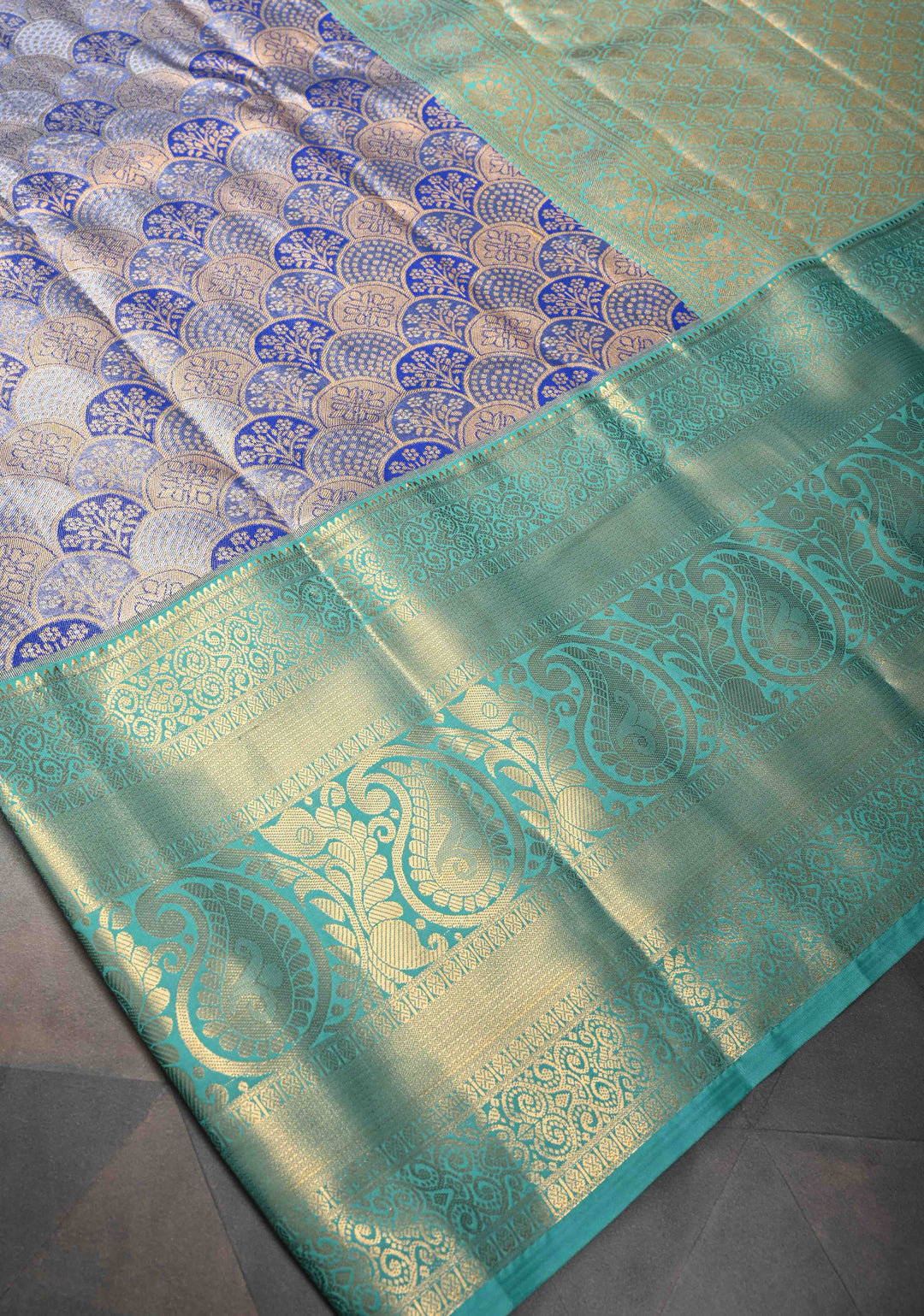 Blue Tissue Semi Silk Saree in Kanchi Style with Floral Scallop Brocade and Wide Contrast Zari Border