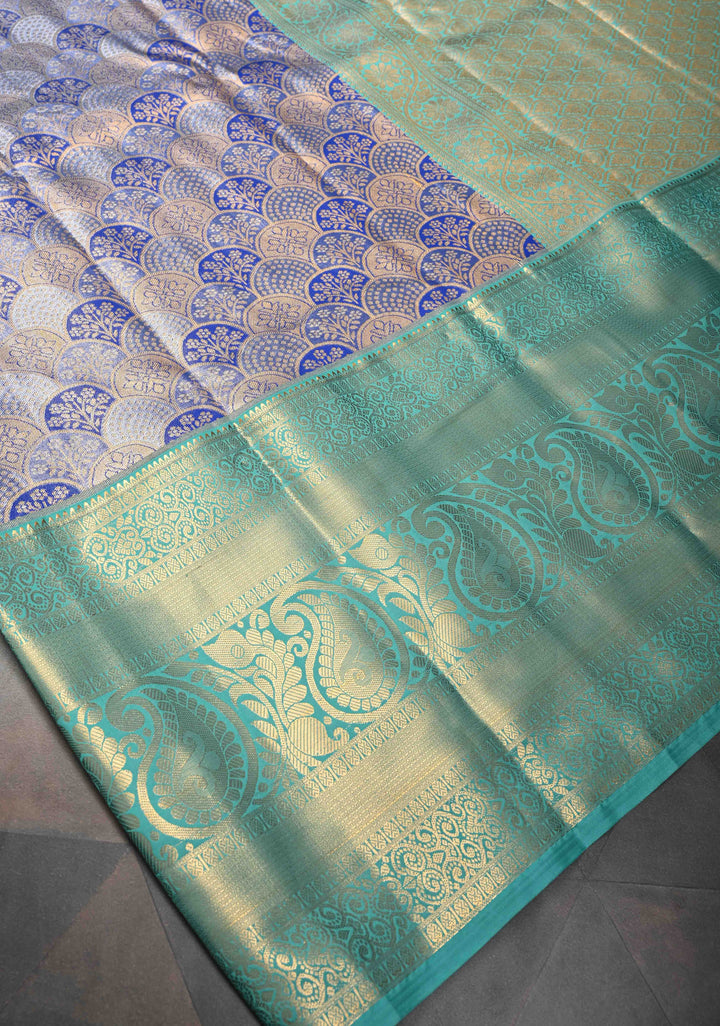 Blue Tissue Semi Silk Saree in Kanchi Style with Floral Scallop Brocade and Wide Contrast Zari Border