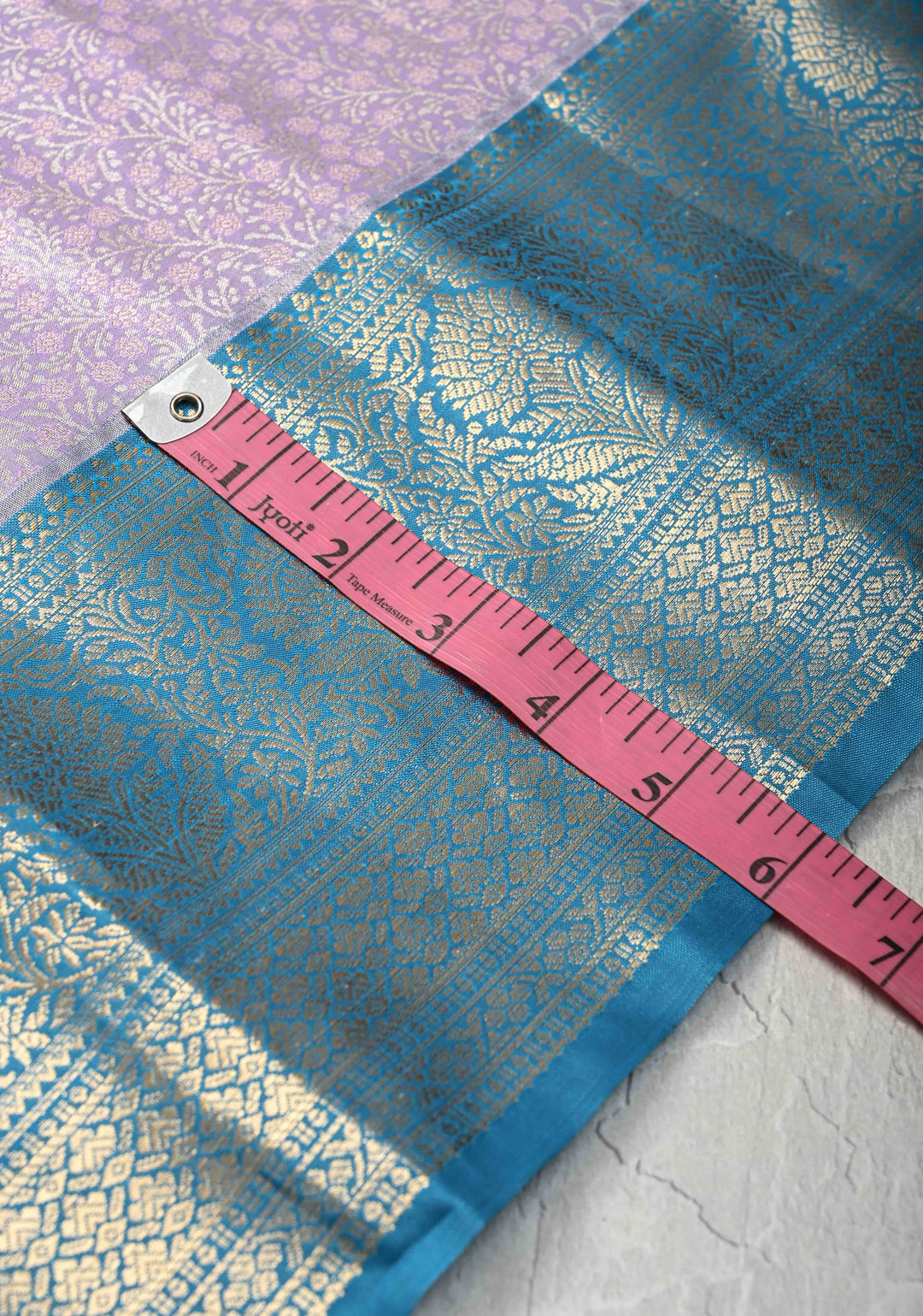 Pastel Purple Brocade Jaal on Kanjivaram Tissue Semi Silk Saree with Meenakari Buttas and Contrast Zari Border