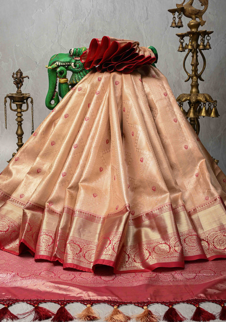 Peach Brocade Jaal on Kanjivaram Tissue Semi Silk Saree with Meenakari Buttas and Contrast Zari Border