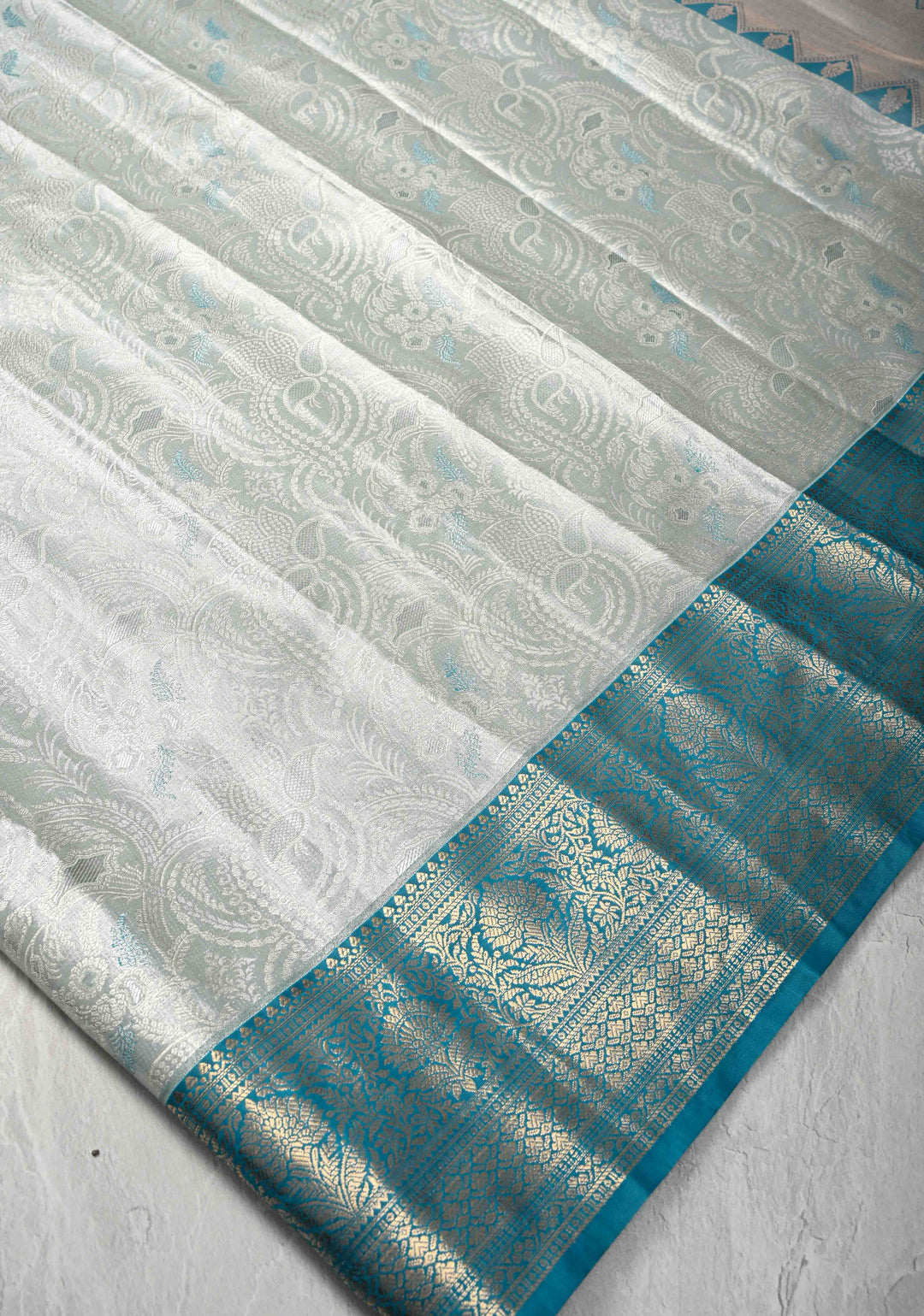 Dusty Sage Green Brocade on Kanjivaram Tissue Semi Silk Saree with Meenakari Buttas and Contrast Zari Border