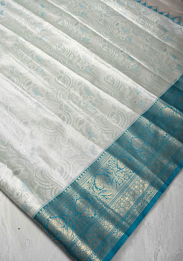 Dusty Sage Green Brocade on Kanjivaram Tissue Semi Silk Saree with Meenakari Buttas and Contrast Zari Border