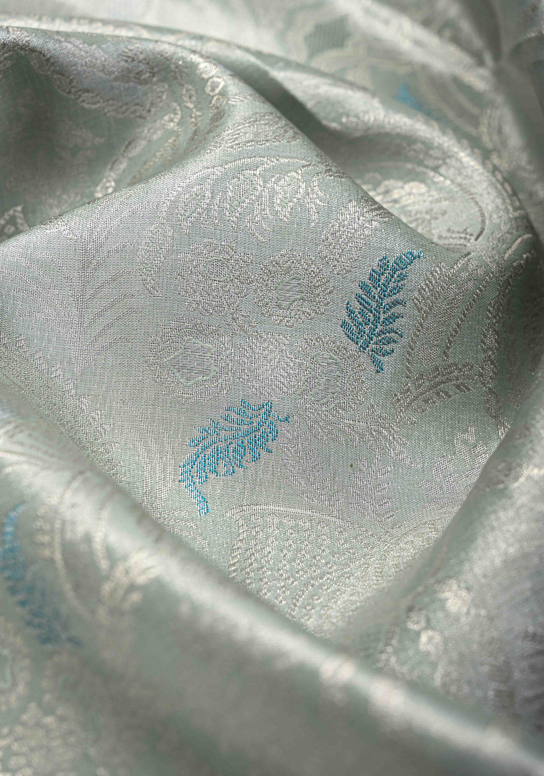Dusty Sage Green Brocade on Kanjivaram Tissue Semi Silk Saree with Meenakari Buttas and Contrast Zari Border
