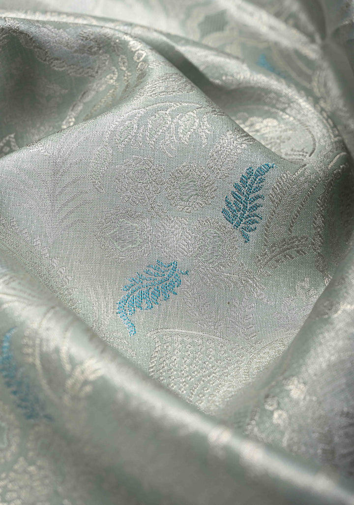 Dusty Sage Green Brocade on Kanjivaram Tissue Semi Silk Saree with Meenakari Buttas and Contrast Zari Border