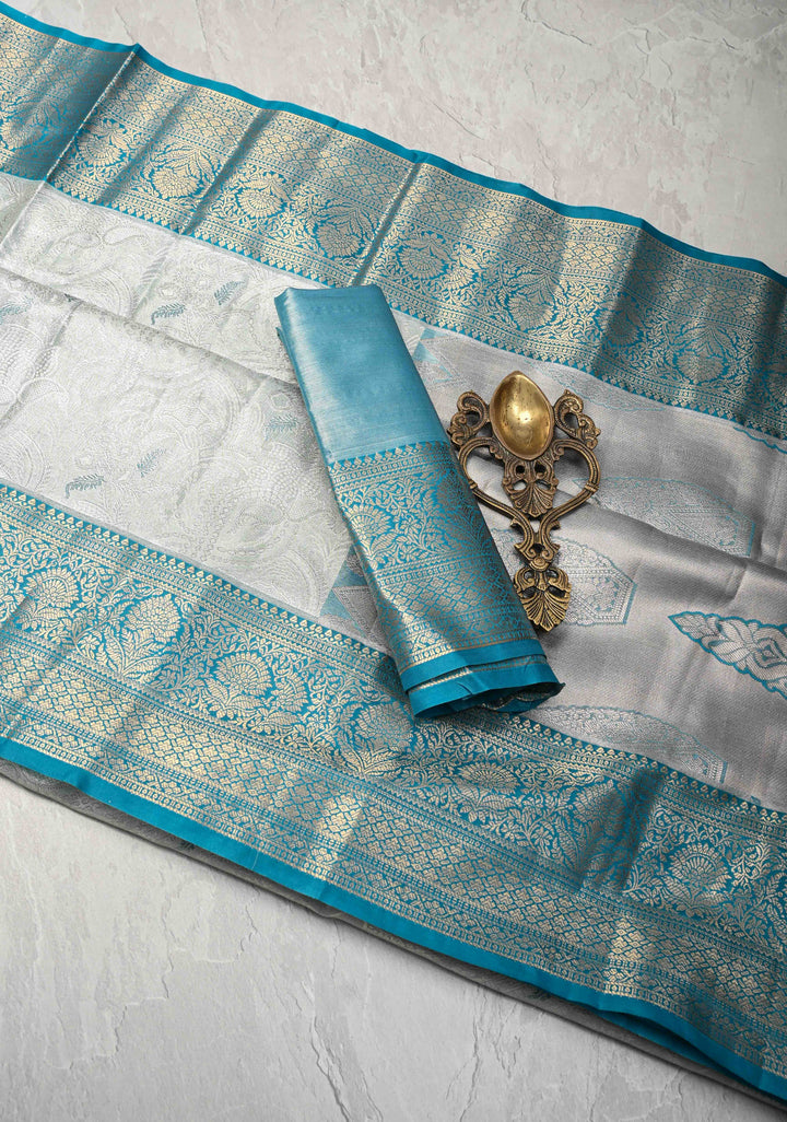 Dusty Sage Green Brocade on Kanjivaram Tissue Semi Silk Saree with Meenakari Buttas and Contrast Zari Border