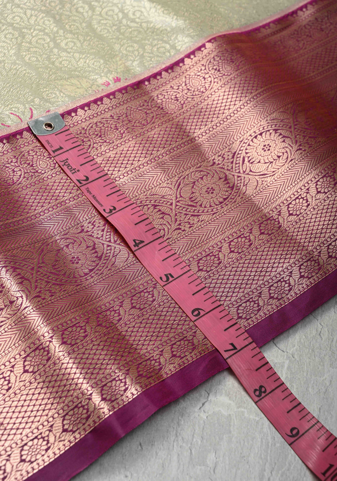 Pale Green Brocade Jaal on Kanjivaram Tissue Semi Silk Saree with Meenakari Buttas and Contrast Zari Border