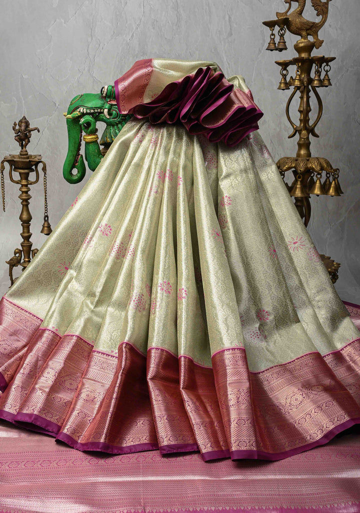 Pale Green Brocade Jaal on Kanjivaram Tissue Semi Silk Saree with Meenakari Buttas and Contrast Zari Border