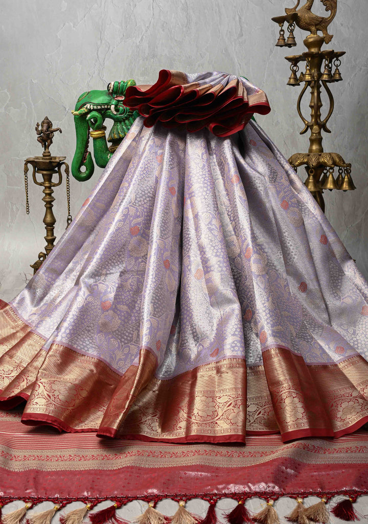 Light Lavender Brocade on Kanjivaram Tissue Semi Silk Saree with Meenakari Buttas and Contrast Zari Border
