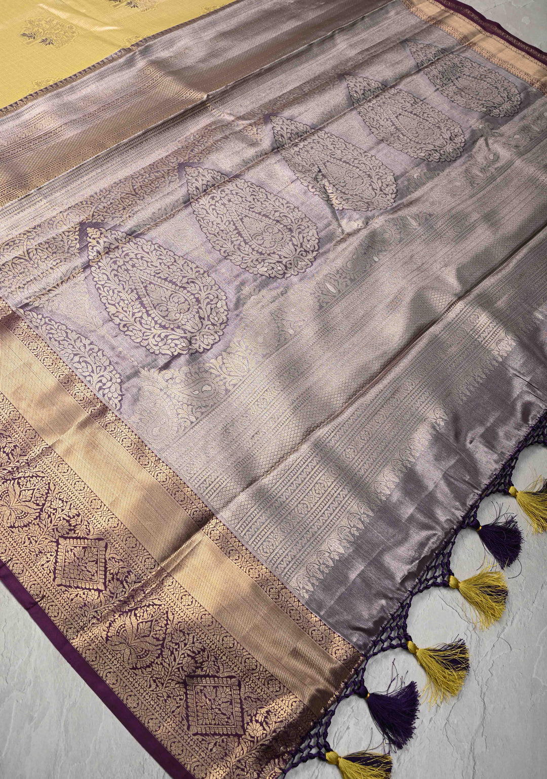 Pale Yellow Brocade on Kanjivaram Tissue Semi Silk Saree with Meenakari Buttas and Contrast Zari Border