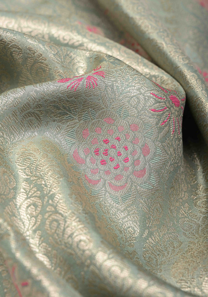 Sage Green Floral Brocade on Kanjivaram Tissue Semi Silk Saree with Meenakari Buttas and Contrast Zari Border