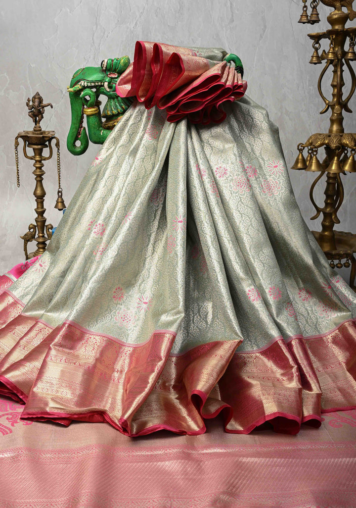 Sage Green Floral Brocade on Kanjivaram Tissue Semi Silk Saree with Meenakari Buttas and Contrast Zari Border