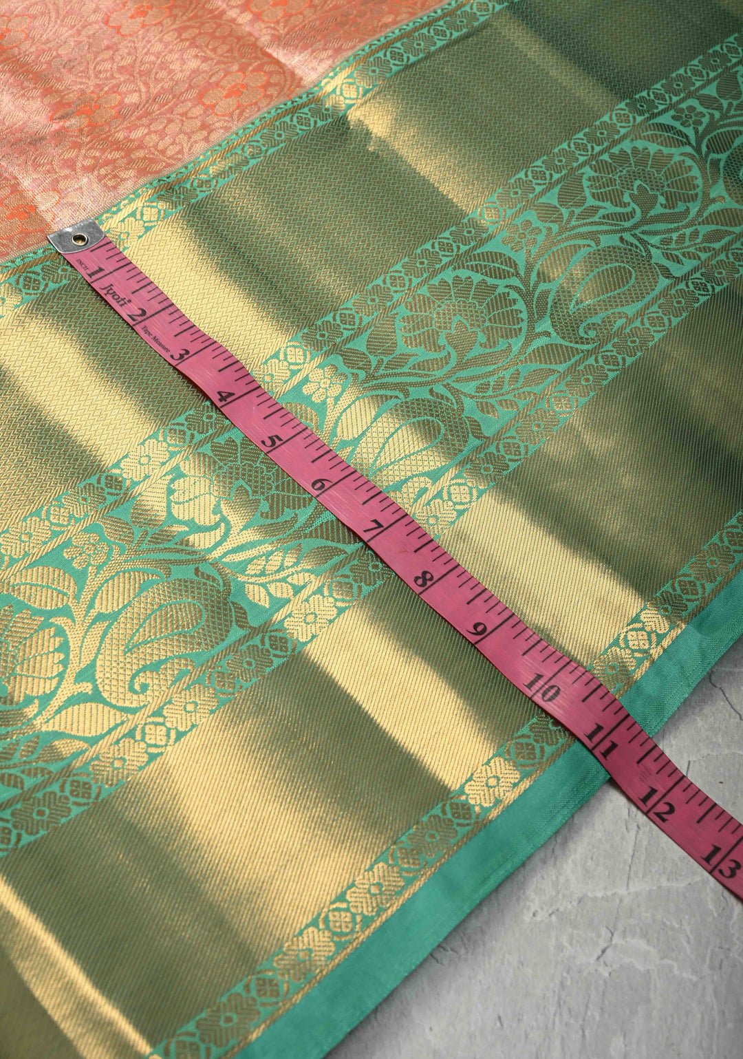 Coral Orange Kanjivaram Tissue Semi Silk Saree with Meenakari Brocade Jaal and Contrast Wide Zari Border