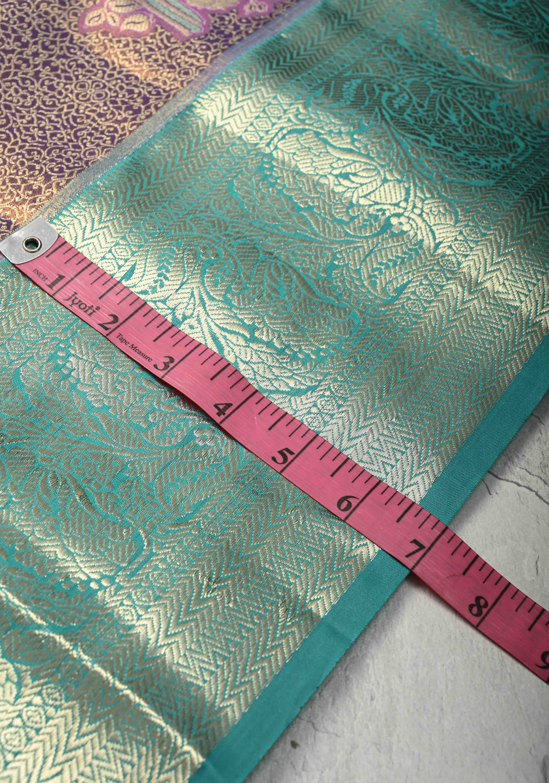 Purple Brocade Jaal on Kanjivaram Tissue Semi Silk Saree with Meenakari Twin Birds Buttas and Contrast Zari Border