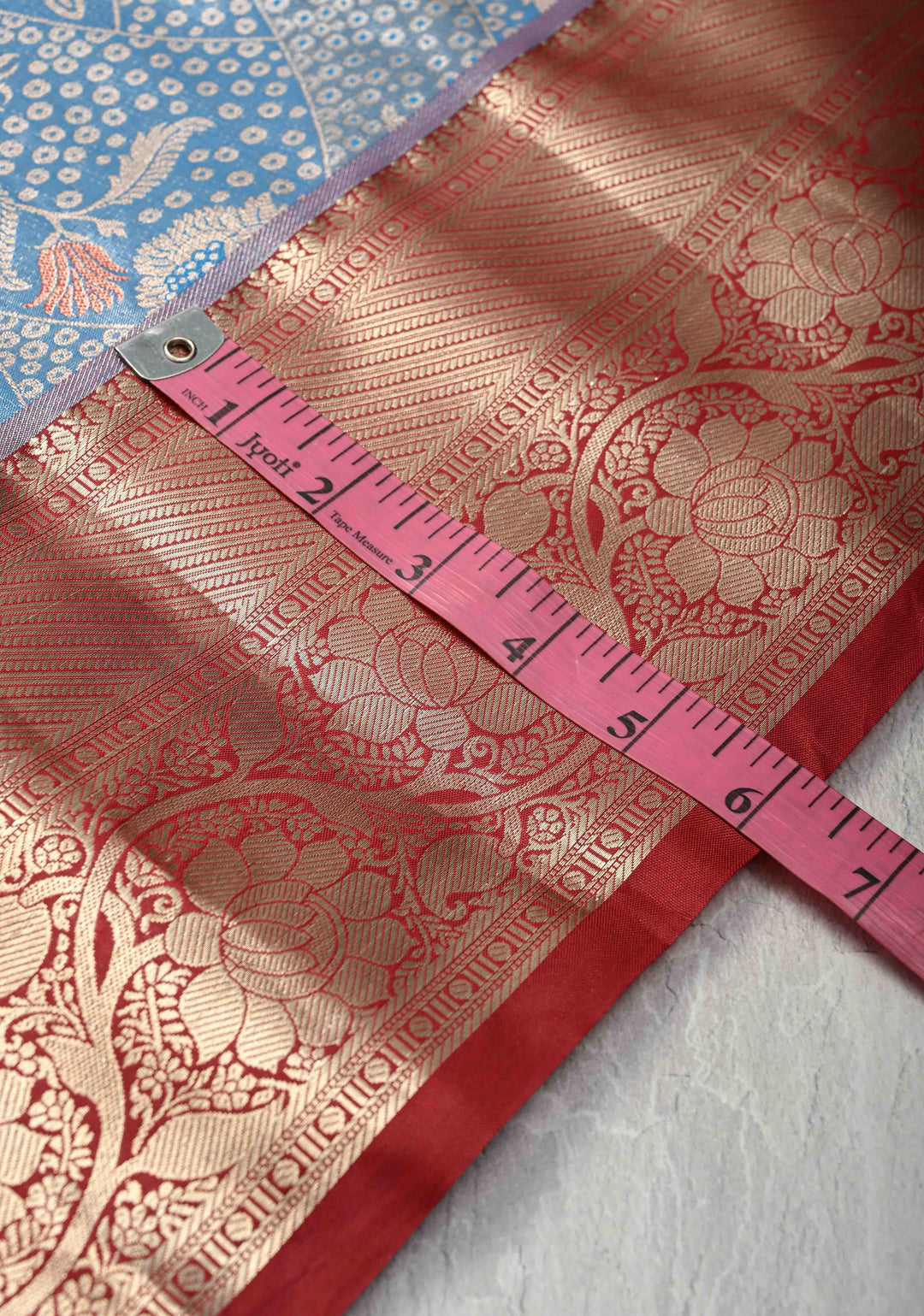Azure Blue Floral Brocade on Kanjivaram Tissue Semi Silk Saree with Meenakari Buttas and Contrast Zari Border