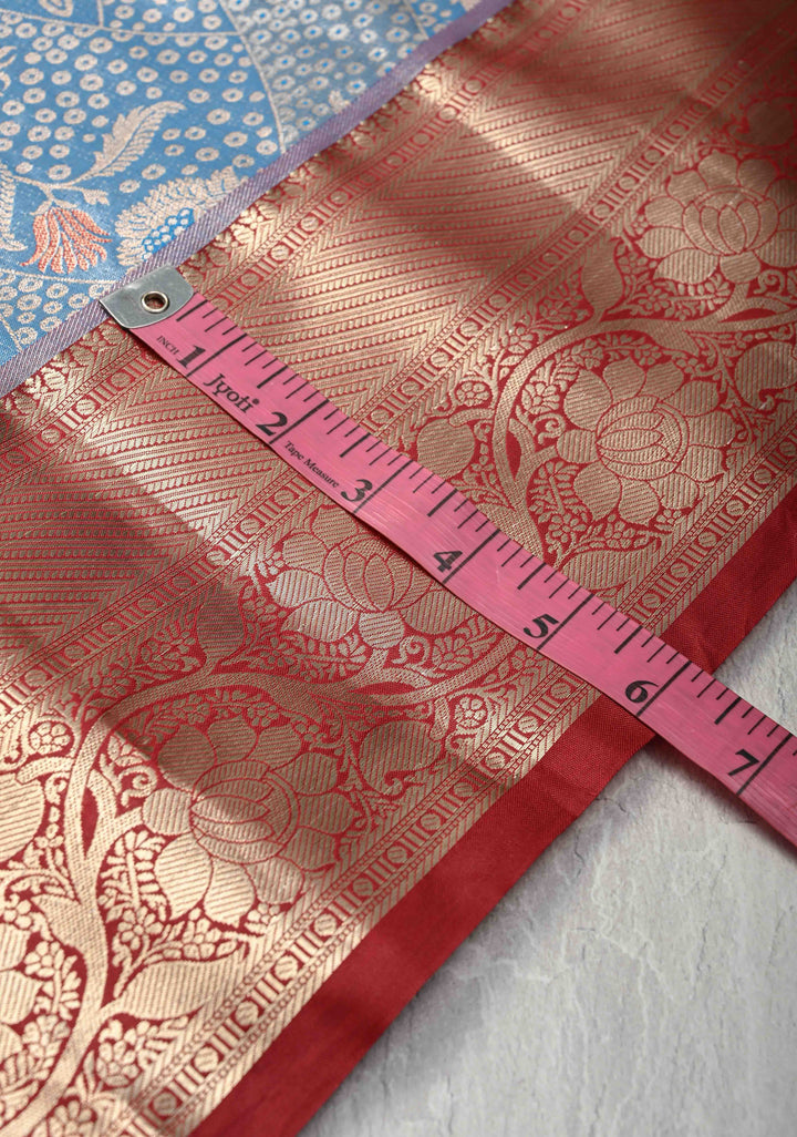 Azure Blue Floral Brocade on Kanjivaram Tissue Semi Silk Saree with Meenakari Buttas and Contrast Zari Border