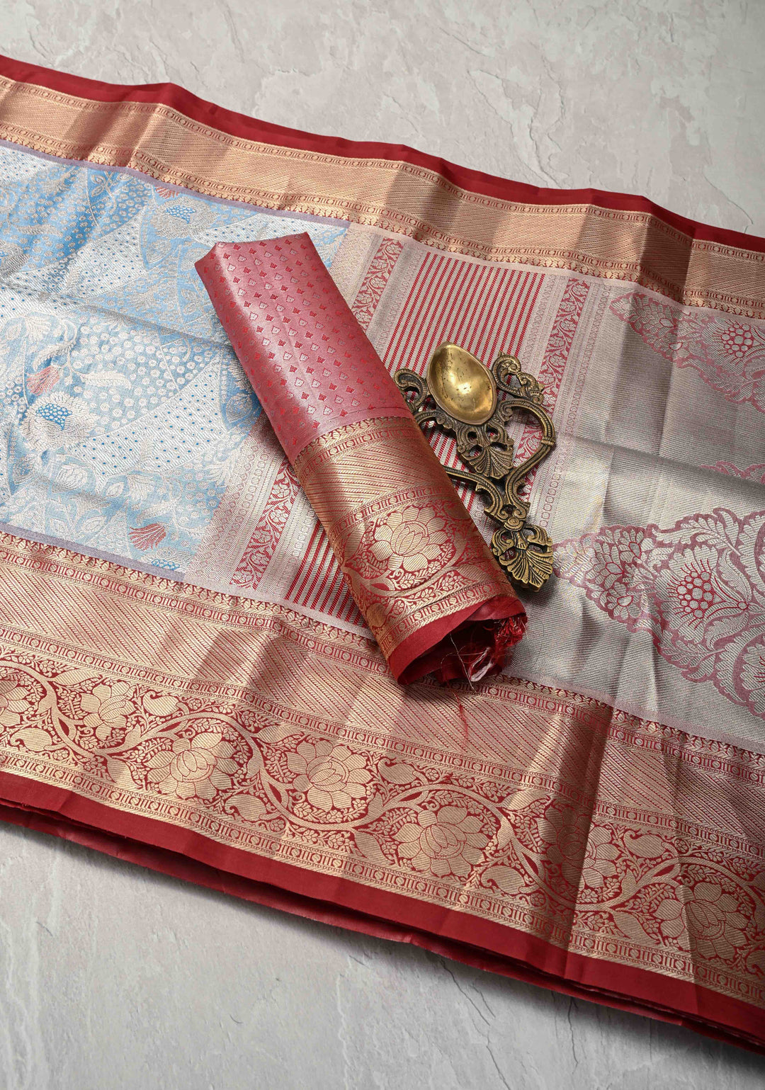 Azure Blue Floral Brocade on Kanjivaram Tissue Semi Silk Saree with Meenakari Buttas and Contrast Zari Border