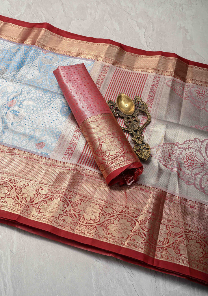 Azure Blue Floral Brocade on Kanjivaram Tissue Semi Silk Saree with Meenakari Buttas and Contrast Zari Border