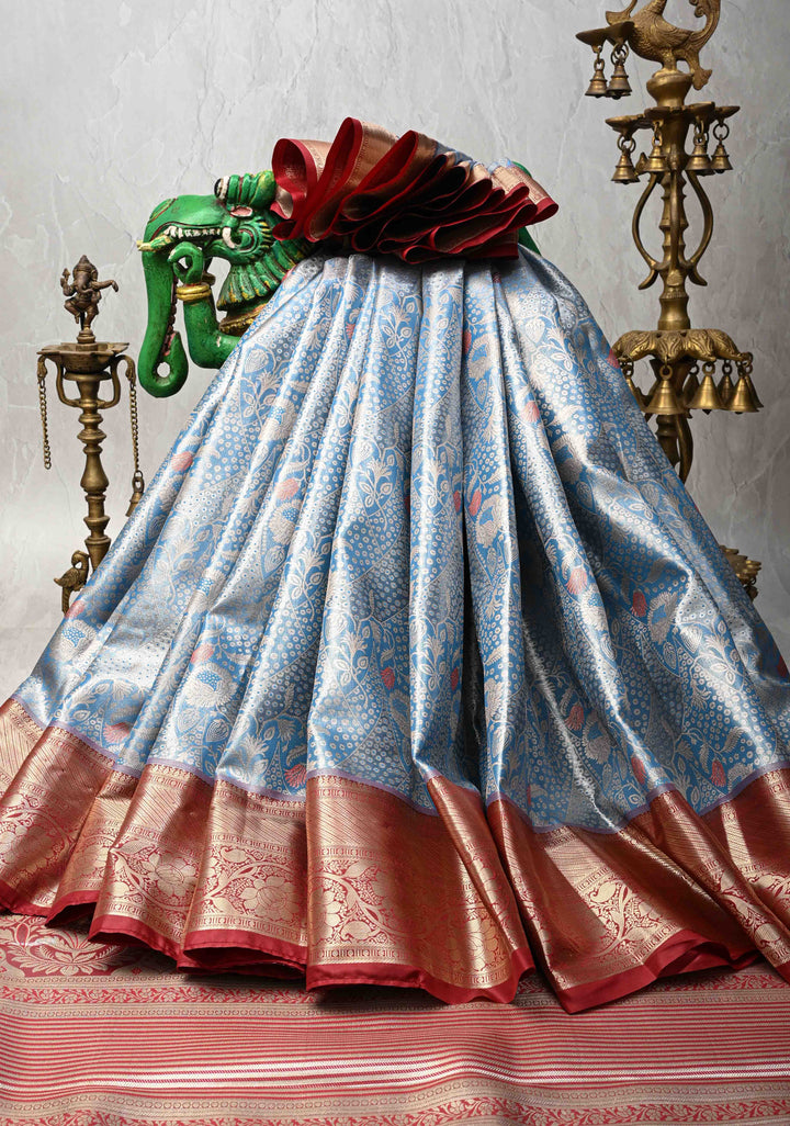 Azure Blue Floral Brocade on Kanjivaram Tissue Semi Silk Saree with Meenakari Buttas and Contrast Zari Border