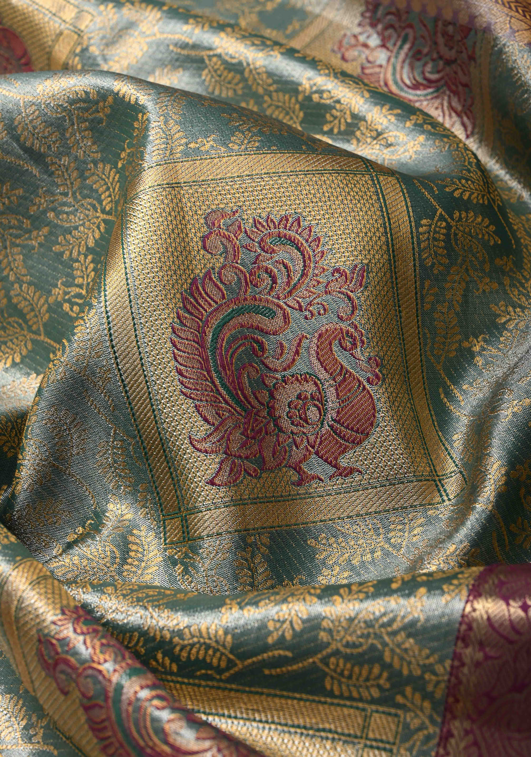 Teal Brocade Jaal on Kanjivaram Tissue Semi Silk Saree with Meenakari Peacock Buttas and Zari Border