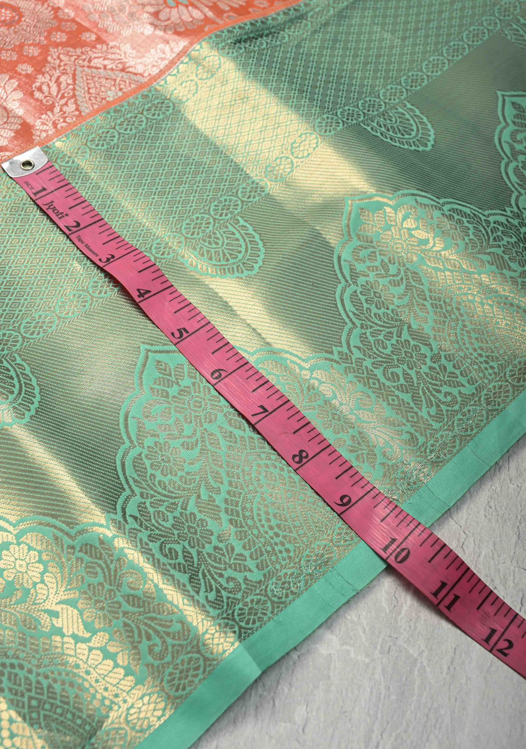 Orange Kanjivaram Tissue Semi Silk Saree with Meenakari Floral Brocade and Contrast Zari Border