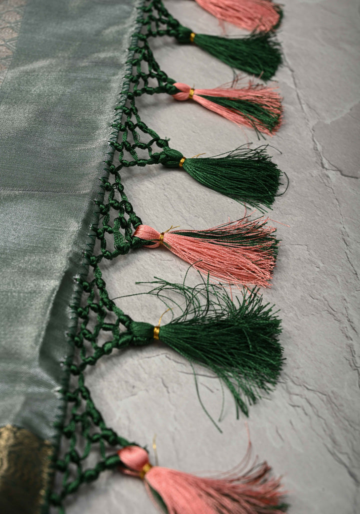 Salmon Brocade Jaal on Kanjivaram Tissue Semi Silk Saree with Meenakari Buttas and Contrast Zari Border