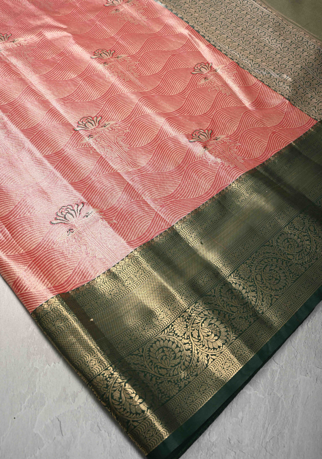 Salmon Brocade Jaal on Kanjivaram Tissue Semi Silk Saree with Meenakari Buttas and Contrast Zari Border