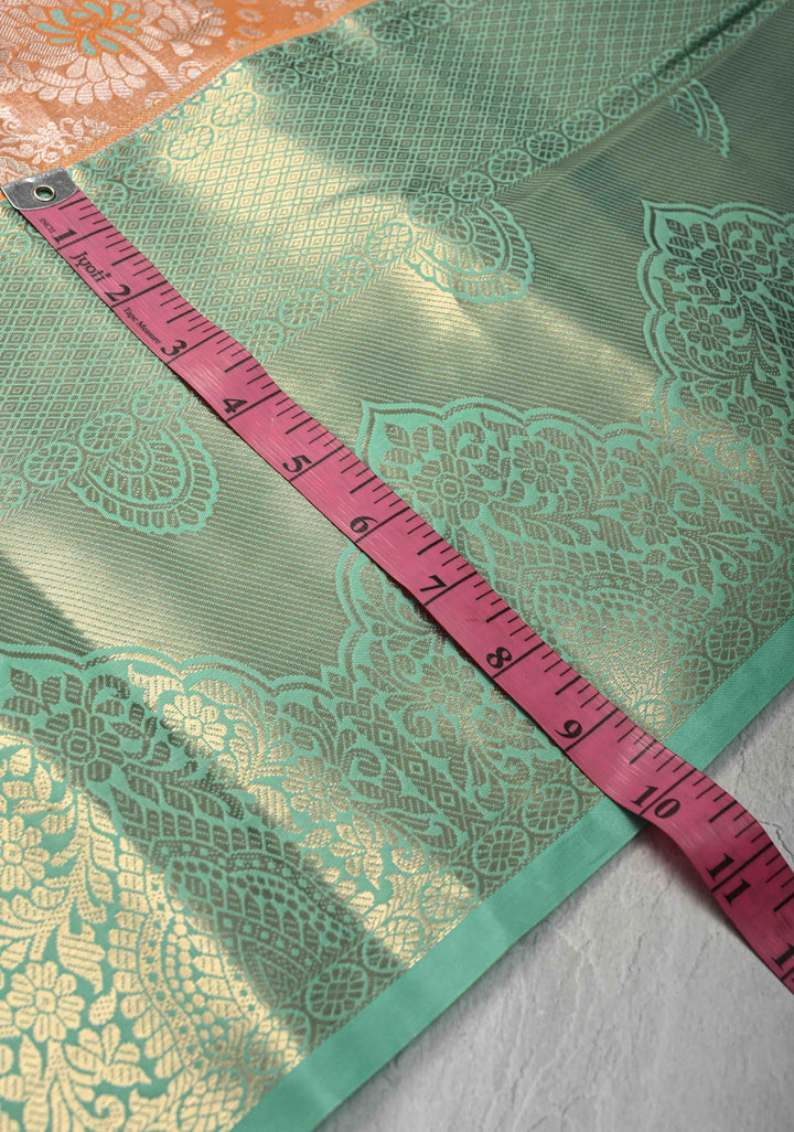 Orange Brocade on Kanjivaram Tissue Semi Silk Saree with Meenakari Buttas and Contrast Wide Zari Border