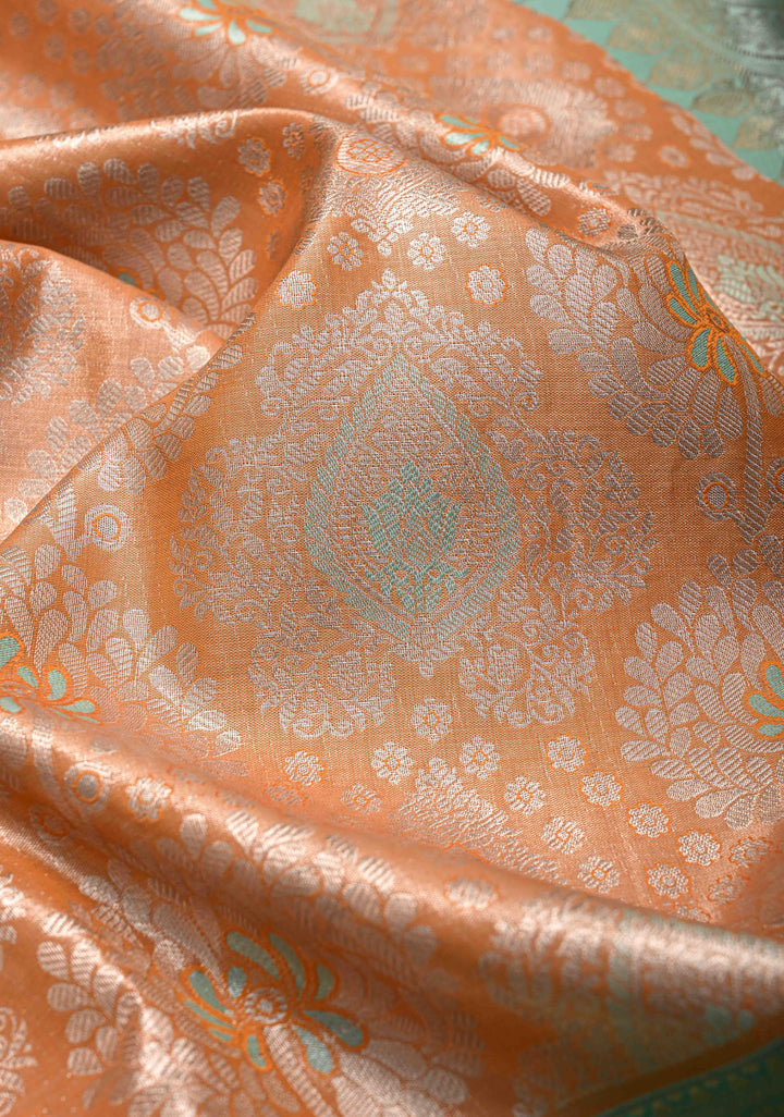 Orange Brocade on Kanjivaram Tissue Semi Silk Saree with Meenakari Buttas and Contrast Wide Zari Border
