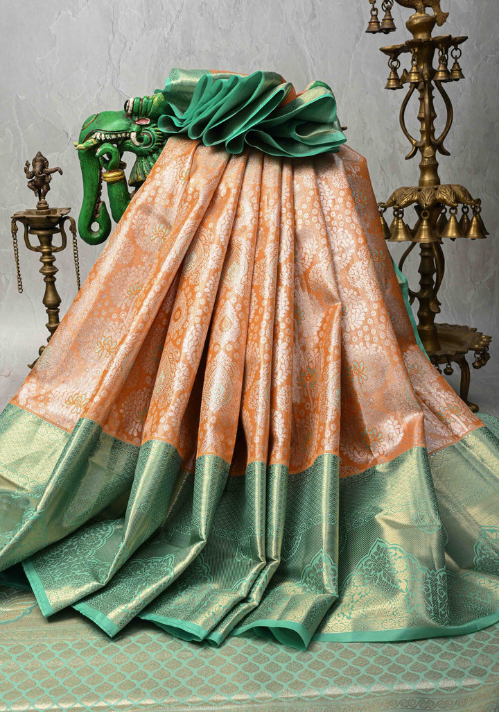 Orange Brocade on Kanjivaram Tissue Semi Silk Saree with Meenakari Buttas and Contrast Wide Zari Border
