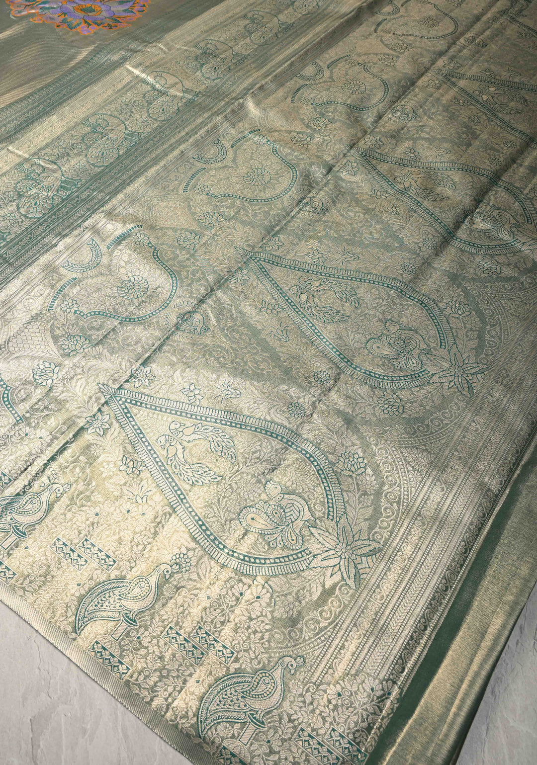Gold-Blue Kanjivaram Tissue Semi Silk Saree with Meenakari Buttas and Peacock Scallop Border
