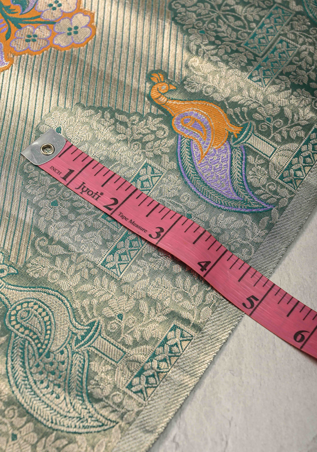 Gold-Blue Kanjivaram Tissue Semi Silk Saree with Meenakari Buttas and Peacock Scallop Border