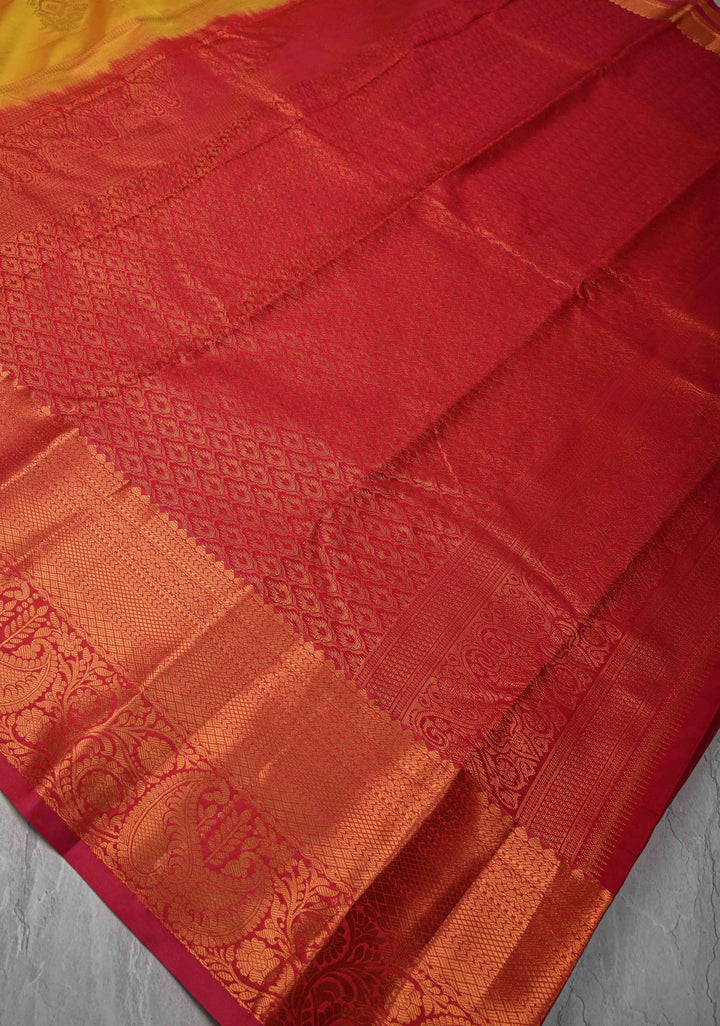 Mustard Yellow Kanjivaram Semi Silk Saree with Meenakari Buttas and Contrast Zari Border