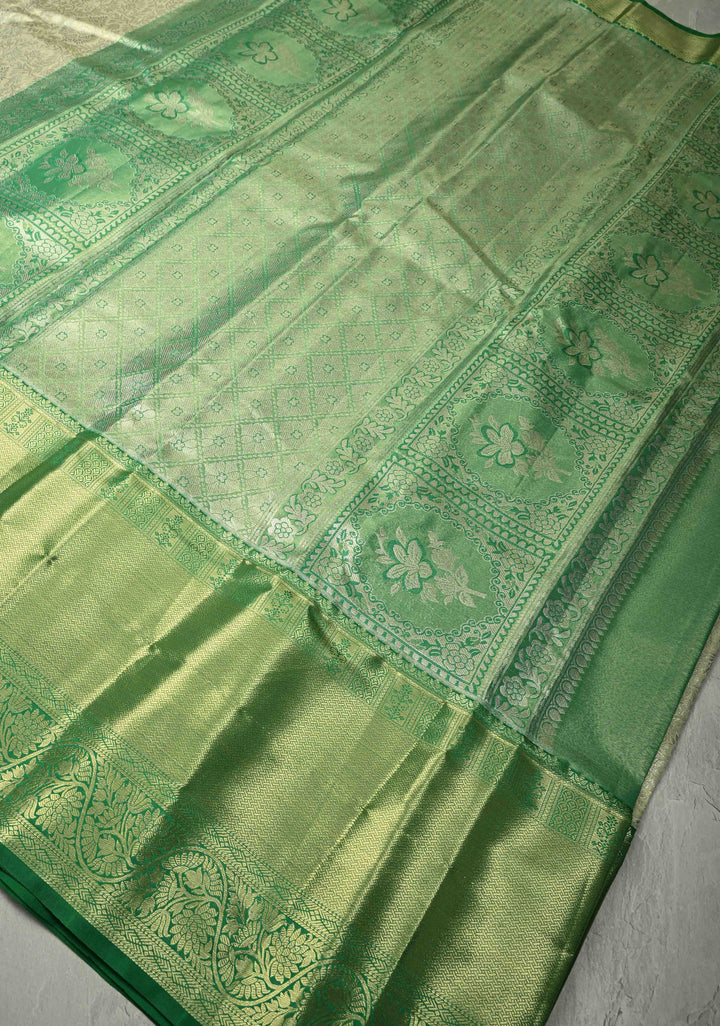 Sage Green Kanjivaram Tissue Semi Silk Saree with Floral Brocade Jaal and Contrast Wide Zari Border