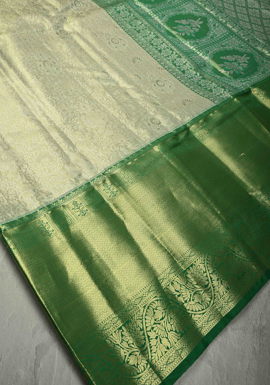 Sage Green Kanjivaram Tissue Semi Silk Saree with Floral Brocade Jaal and Contrast Wide Zari Border