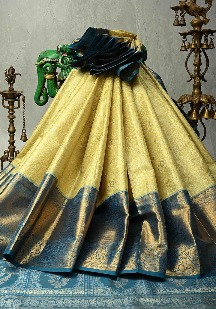 Butter Yellow Kanjivaram Tissue Semi Silk Saree with Meenakari Floral Brocade Jaal and Blue Zari Border