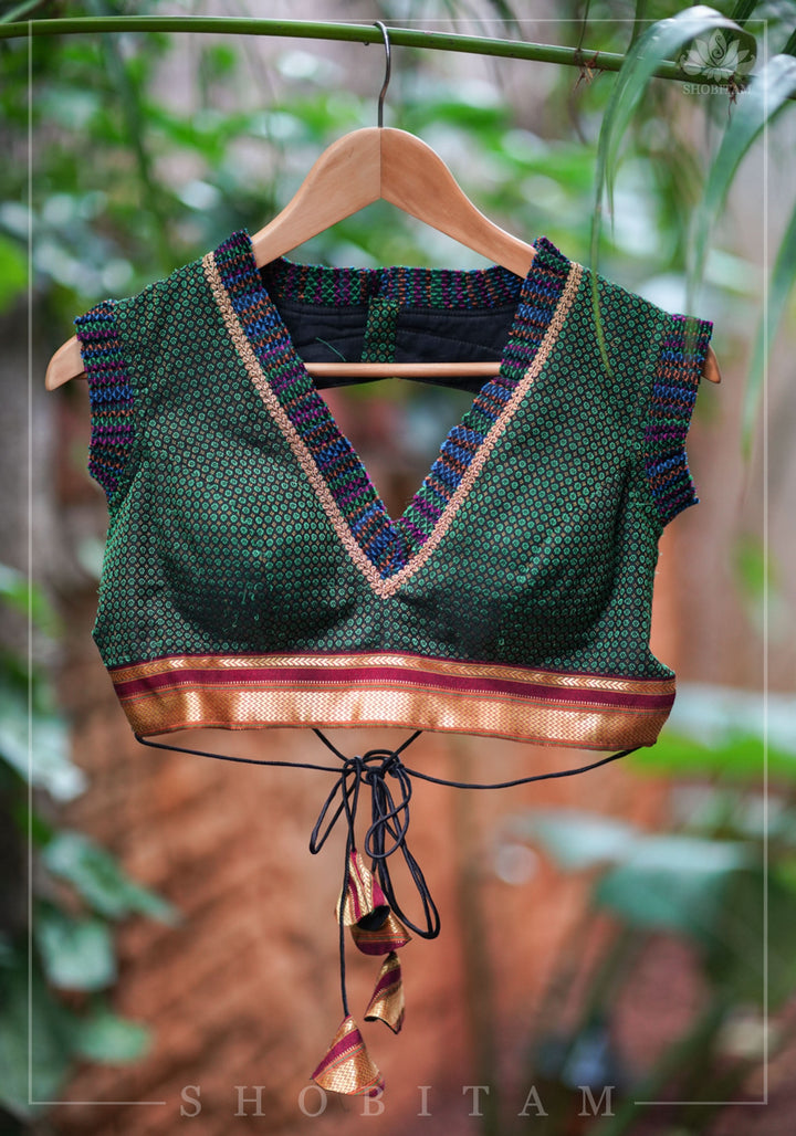 Dark green & black khana silk V neck blouse with frill detailing and backless design< made to order