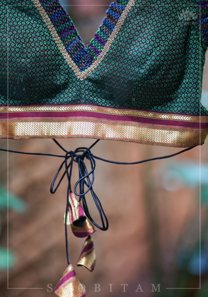 Dark green & black khana silk V neck blouse with frill detailing and backless design< made to order