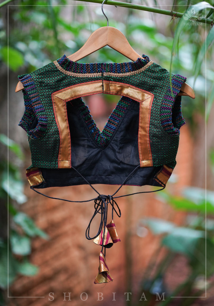 Dark green & black khana silk V neck blouse with frill detailing and backless design< made to order
