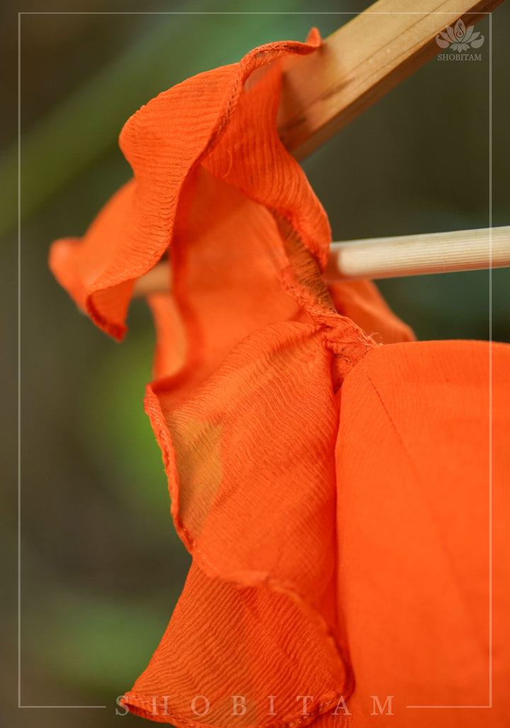 Orange chiffon sweetheart neck blouse with ruffle sleeves