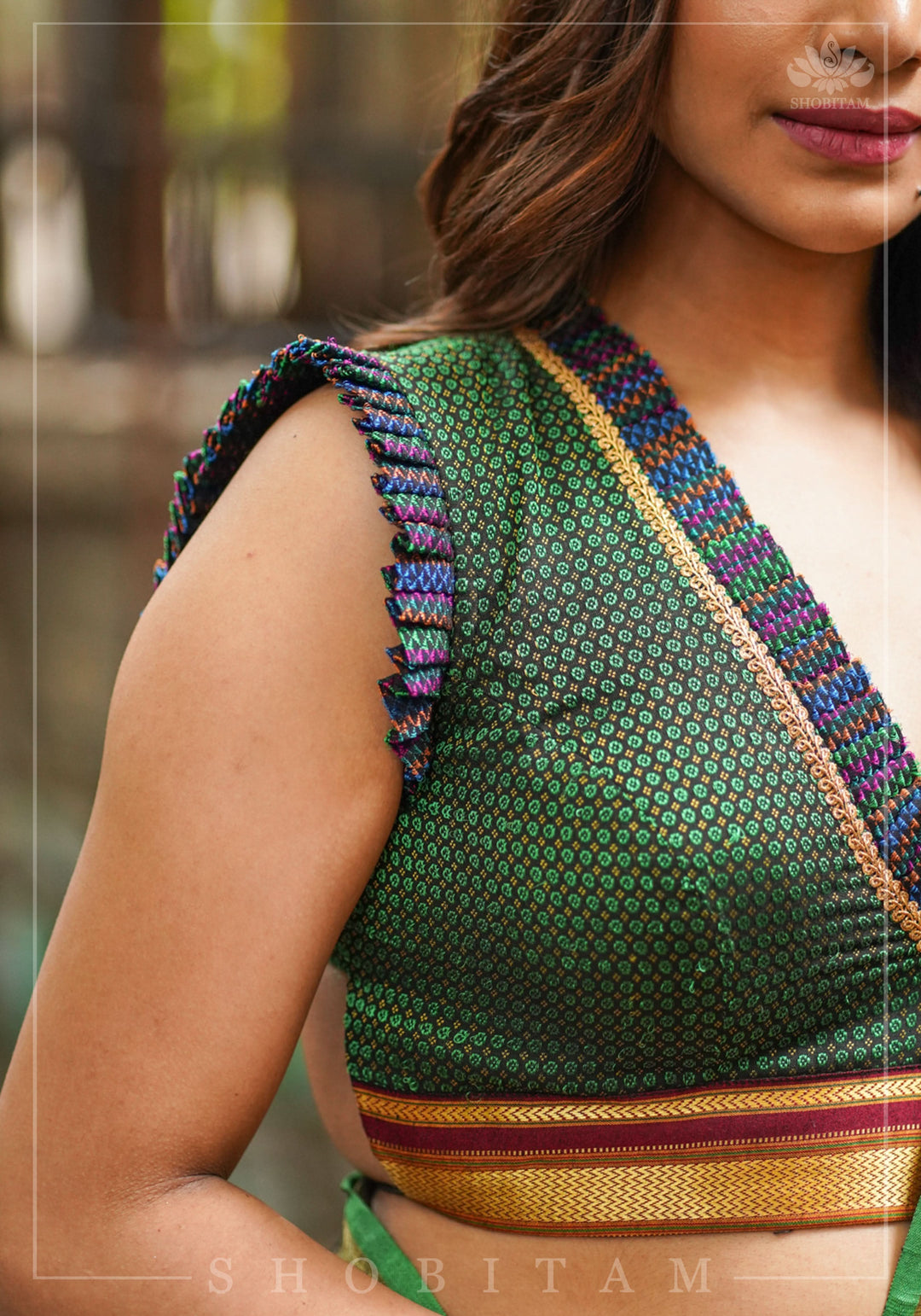Dark green & black khana silk V neck blouse with frill detailing and backless design< made to order