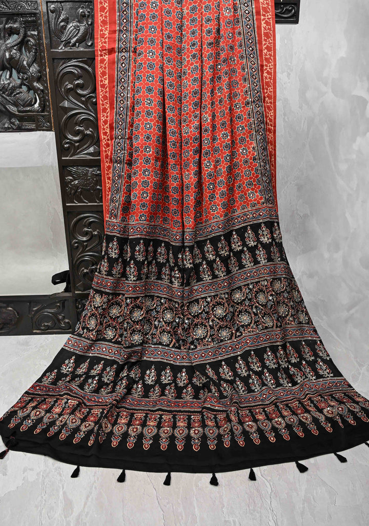 Brick Red Modal Silk Saree with Ajrakh Hand Block Print and mirror, sequins aari work